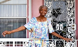Elderly woman on porch