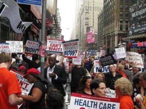 Thousands took to the streets of Manhattan to call for health care reform in 2009. Kelly and Naomi were HCAN organizers of the rally pictured in Times Square. Photo by Janice Caswell.